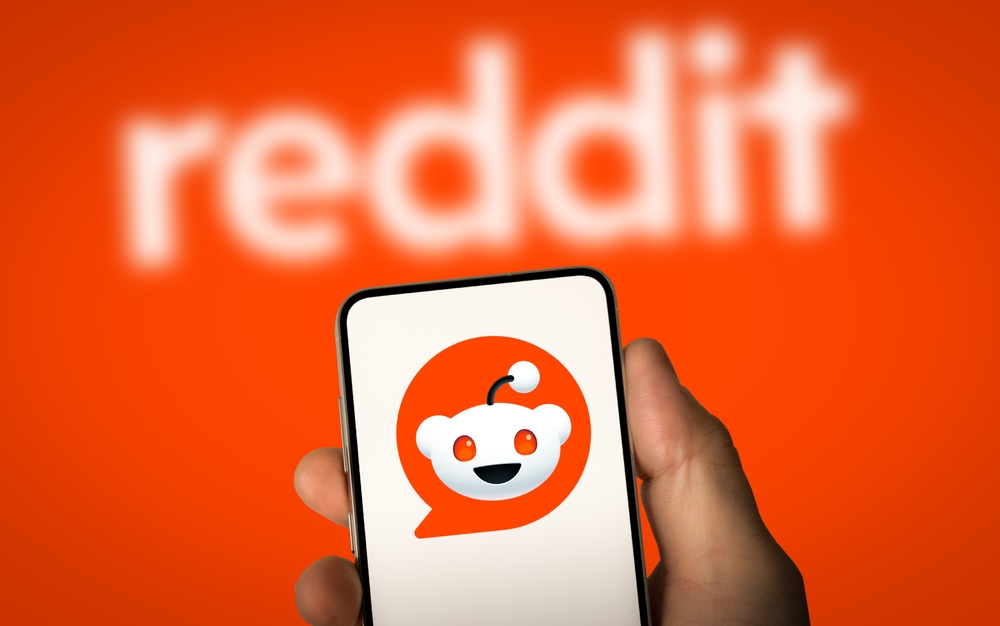 phone with reddit app with red backround