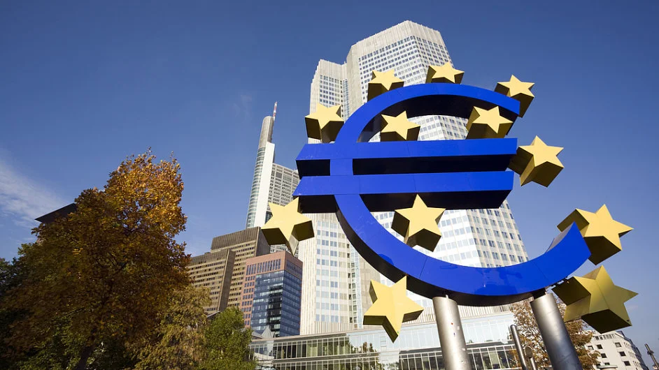 Euro logo with buildings and nature around